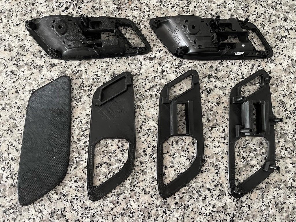 OEM Supra door pulls next to the new 3D printed frames and parts